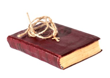 Eski dini kitaplar ve kenevir danteli üzerinde altın haç