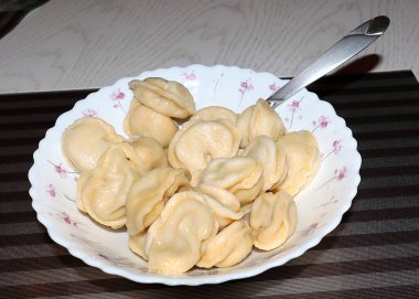 hot russian dumplings on a plate in a summer cafe