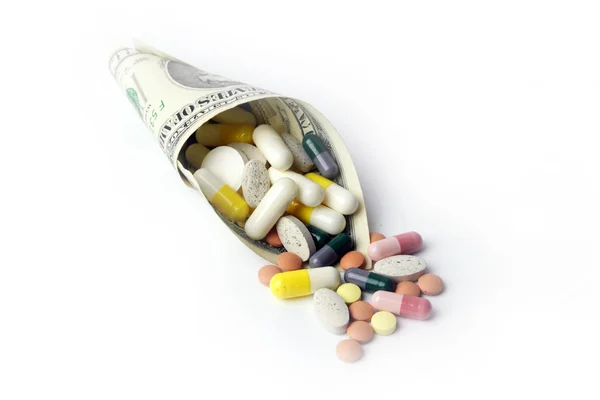 Доллары и лекарства — стоковое фото