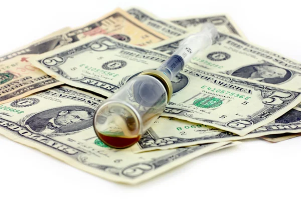 Syringe, ampoule and dollars — Stock Photo, Image