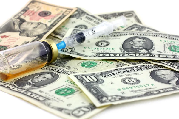 Syringe, ampoule and dollars — Stock Photo, Image