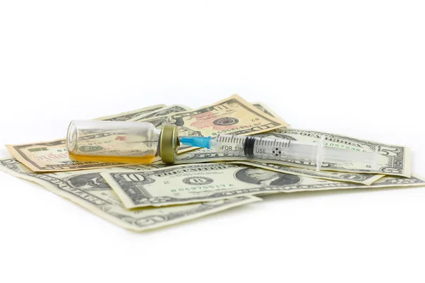 Syringe, ampoule and dollars — Stock Photo, Image