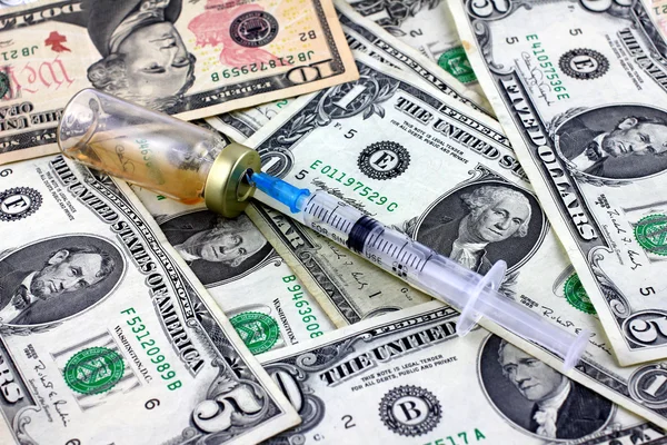 Syringe, ampoule and dollars — Stock Photo, Image