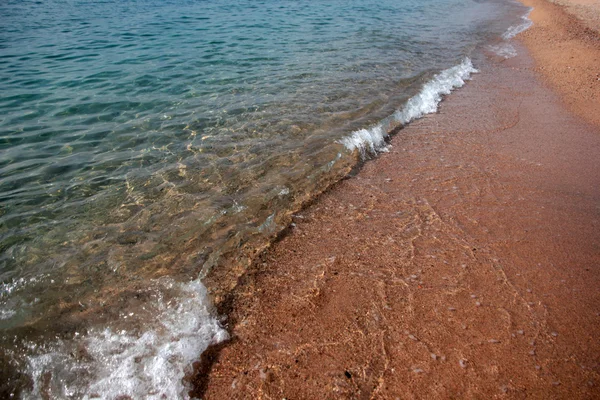 Golven en de zee oever — Stockfoto