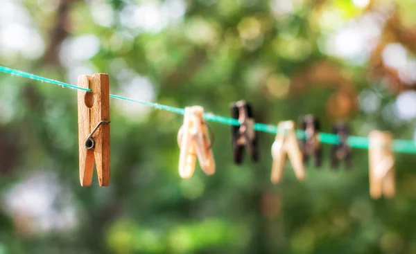 Wooden and plastic clothespins — Stock Photo, Image