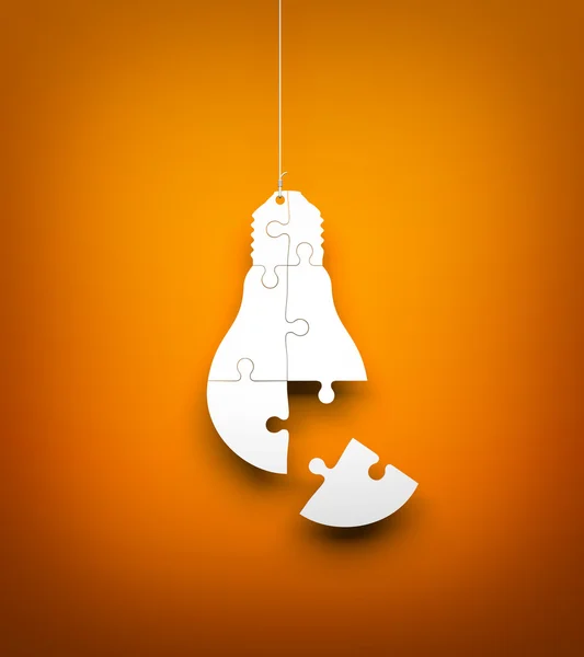 Light bulb from puzzles hanging — Stock Photo, Image