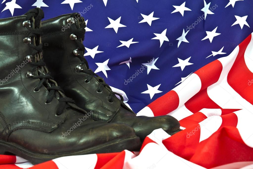 Military boots on American flag