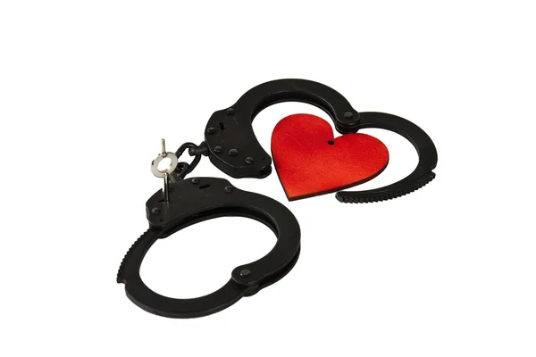 Handcuffs and heart — Stock Photo, Image