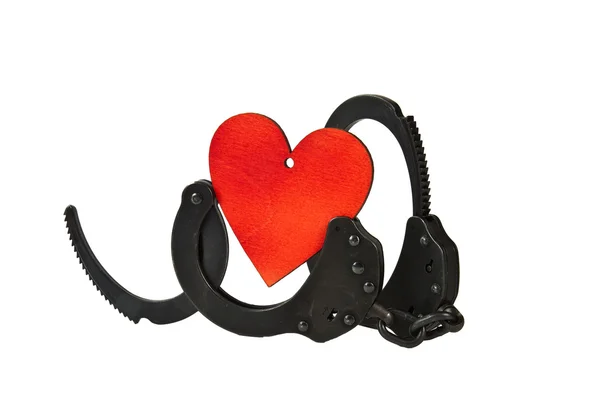 Handcuffs and heart — Stock Photo, Image