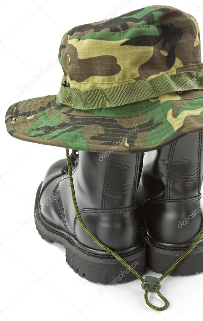 Camouflage hat and military boots
