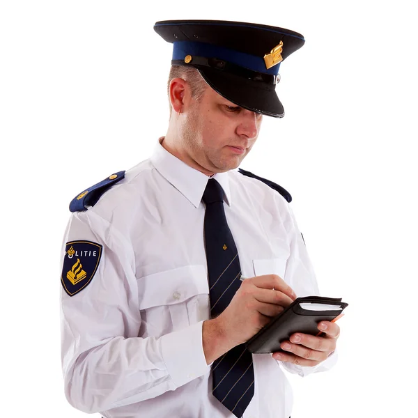 Dutch police officer filling out parking ticket. — Stock Photo, Image