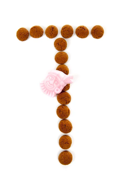 Ginger nakrętki, pepernoten, w kształcie litery T na białym tle na wh — Zdjęcie stockowe