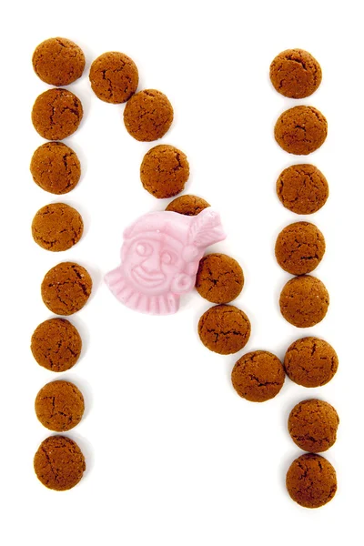 Ginger nakrętki, pepernoten, w kształcie litery N na białym tle na wh — Zdjęcie stockowe