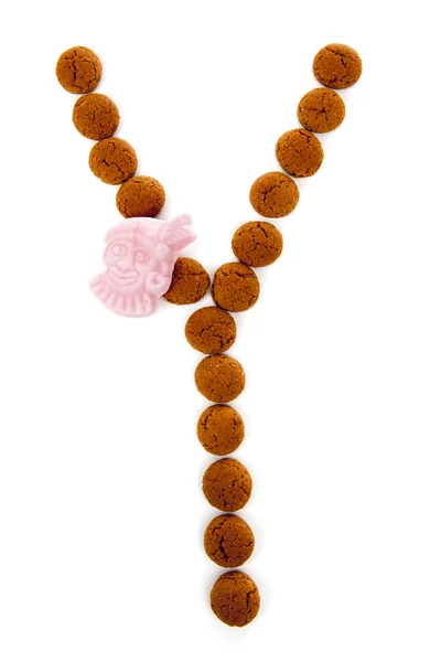Ginger nakrętki, pepernoten, w kształcie litery Y na białym tle na wh — Zdjęcie stockowe