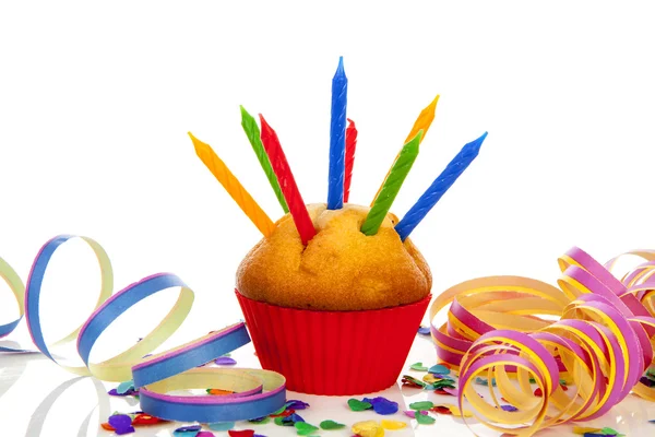 Birthday cupcake with candle and colorful confetti — Stock Photo, Image