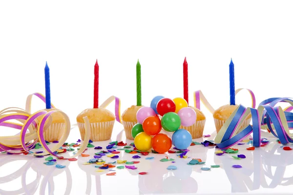 Birthday cupcakes in a row over white background — Stock Photo, Image