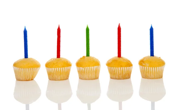 Birthday cupcakes in a row over white background — Stock Photo, Image