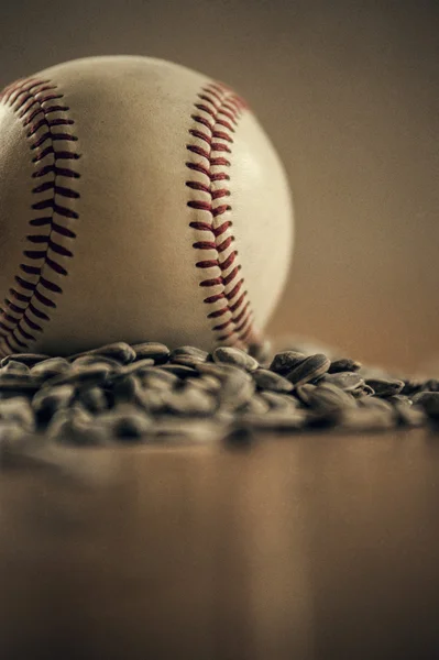 Baseball and sunflower seeds still life — Stock Photo, Image