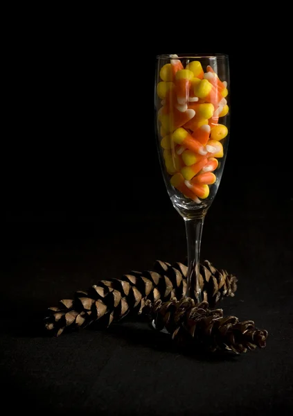 Candy corn in champagne glass — Stock Photo, Image
