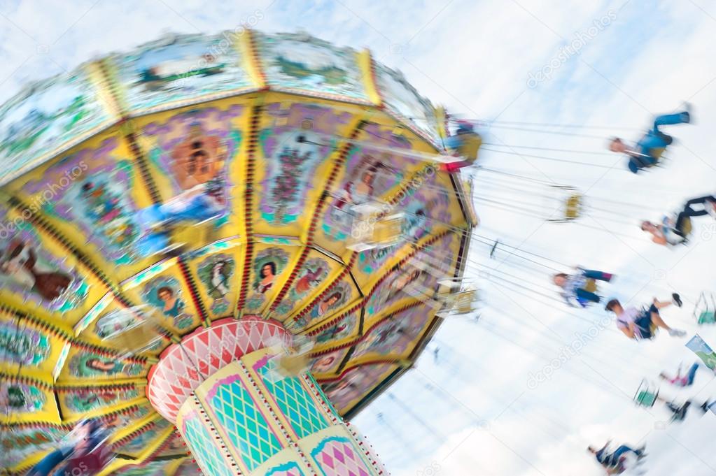 Swinging ride at carnival with motion blur