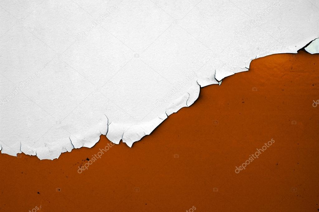 White paint peeling over orange paint