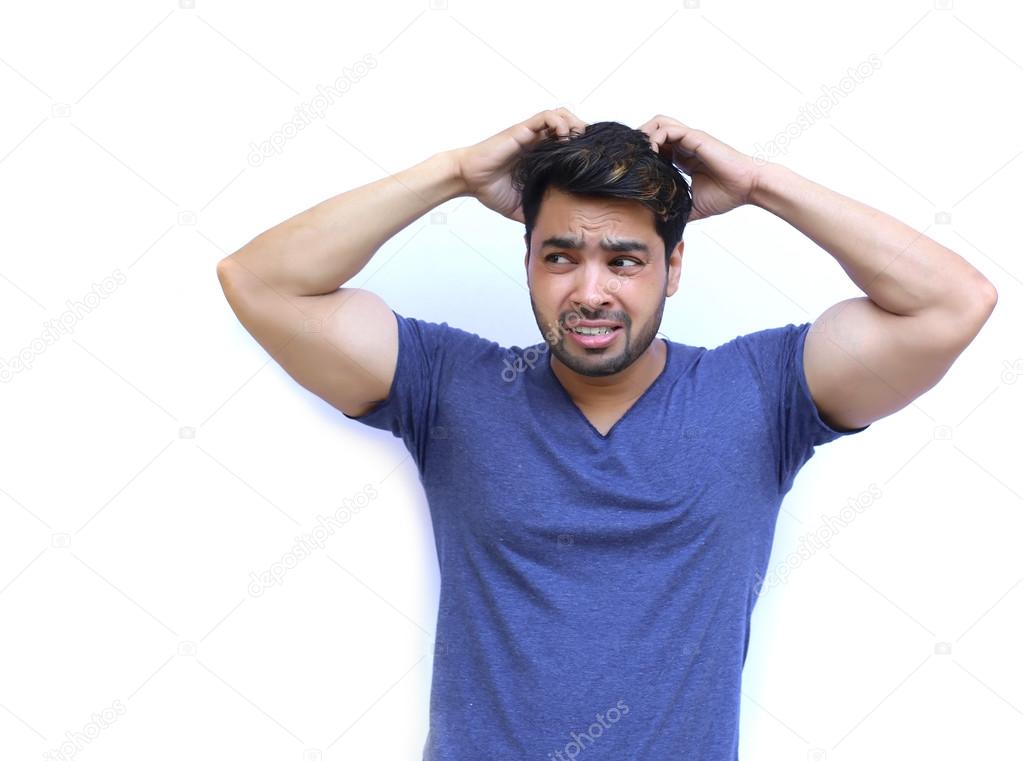 Young Indian Confused man scratching head