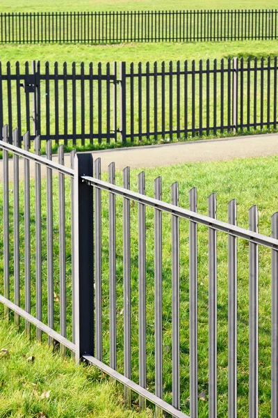 Metal fence in park — Stock Photo, Image