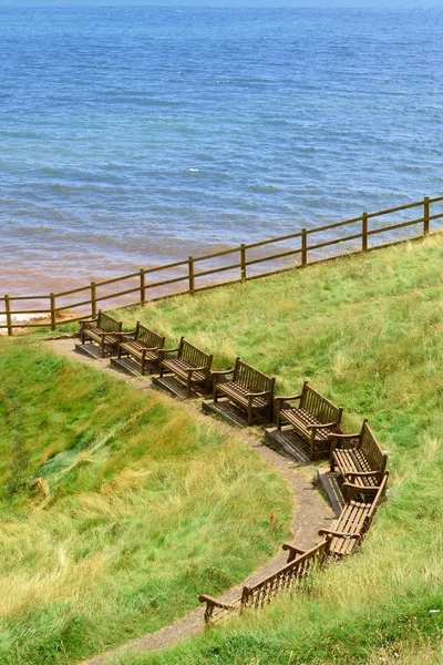 Row of empty benches — Stock Photo, Image