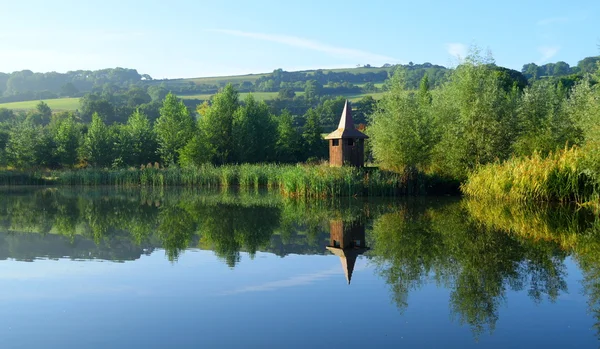 Landscape of lake with hill — Stock Photo, Image