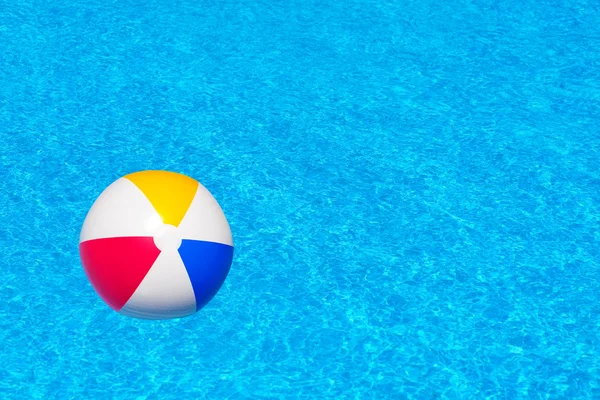 Colorful inflatable ball in swimming pool — Stock Photo, Image