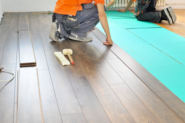 Carpenter doing laminate floor work