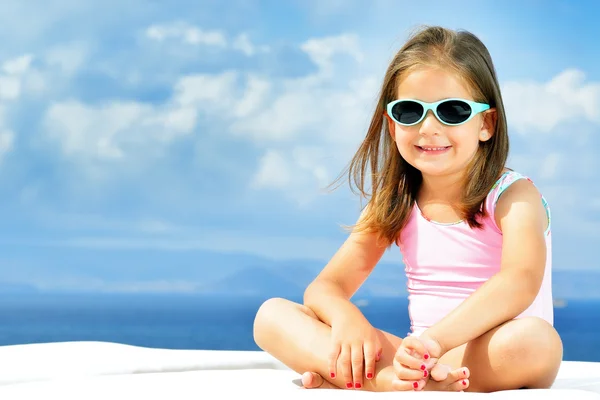 Adorable girl on sunbed — Stock Photo, Image