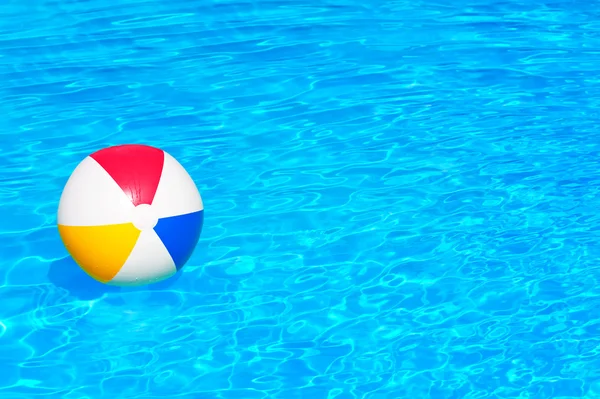 Inflatable ball in swimming pool — Stock Photo, Image