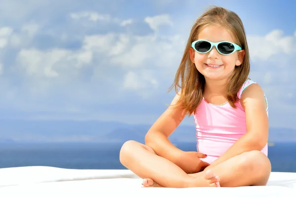 Adorable girl on sunbed — Stock Photo, Image