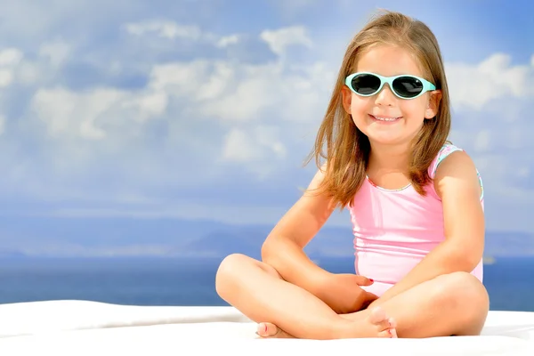 Adorable girl on sunbed — Stock Photo, Image