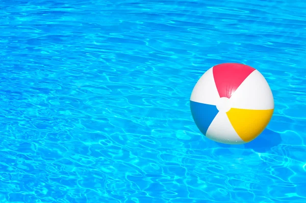 Inflatable ball in swimming pool — Stock Photo, Image