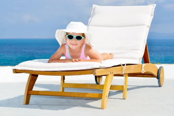 Adorable girl on sunbed — Stock Photo, Image