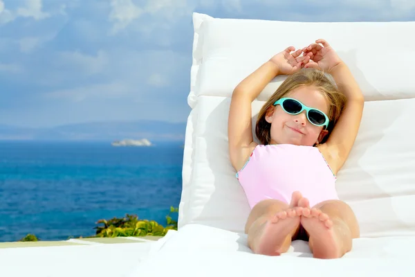 Adorable girl on sunbed — Stock Photo, Image