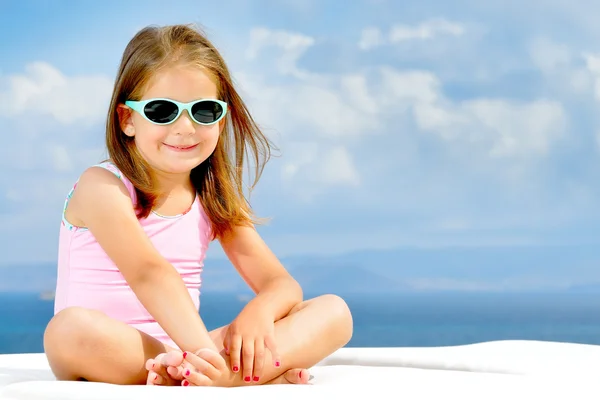 Adorable girl on sunbed — Stock Photo, Image