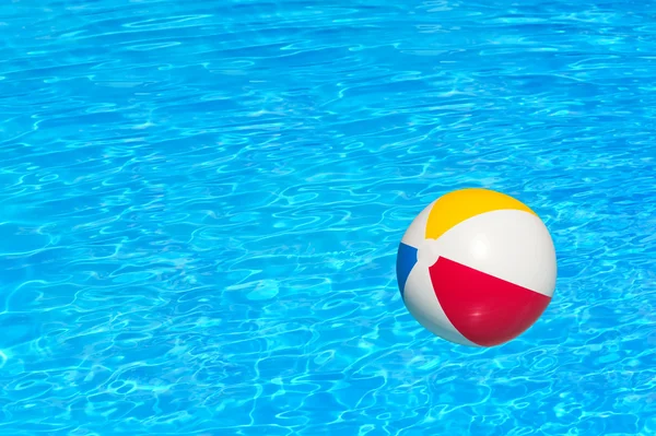 Inflatable ball in swimming pool — Stock Photo, Image