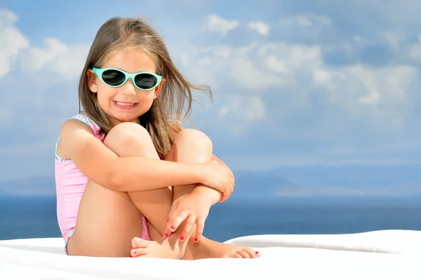 Adorable girl on sunbed — Stock Photo, Image