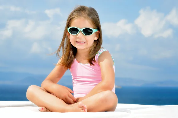Adorable girl on sunbed — Stock Photo, Image