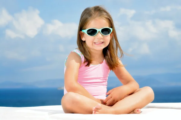 Adorable girl on sunbed — Stock Photo, Image