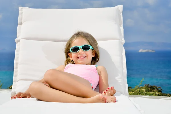 Adorable girl on sunbed — Stock Photo, Image