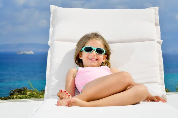 Adorable girl on sunbed — Stock Photo, Image