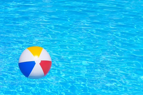 Inflatable ball in swimming pool — Stock Photo, Image