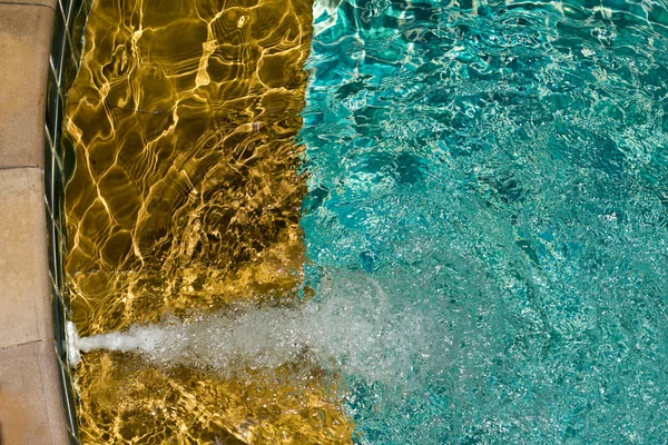 Hotel swimming pool with sunny reflections — Stock Photo, Image