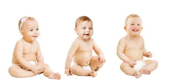 Babies Sitting over White, Toddlers Kids Sit in Diaper, Boy and Girl Royalty Free Stock Images