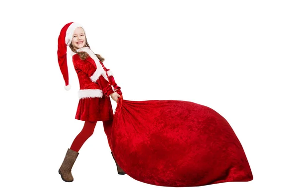 Little Santa Claus Girl Pulling Huge Red Christmas Bag Full — Stock Photo, Image