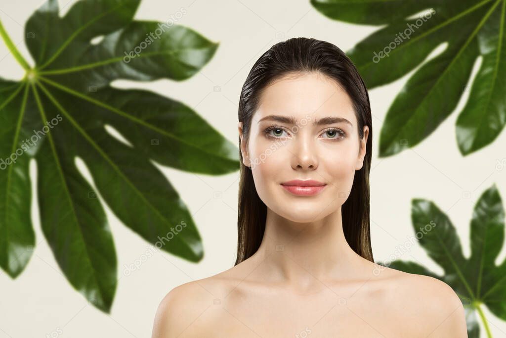 Woman Beauty Face Natural Make up. Green Leaf Cosmetic Skin Care. Wet Hair Perfect Model in Tropical Leaves Nature Background